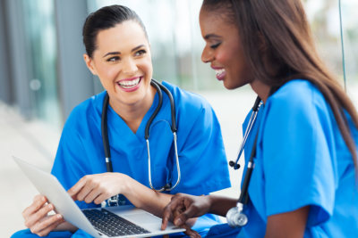 two nurses smiling